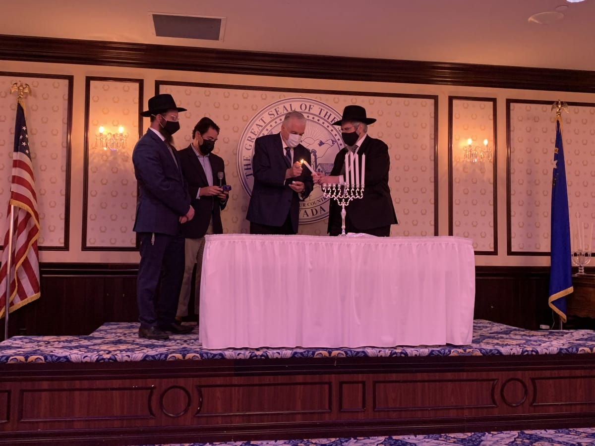 Governor lights menorah with Jewish community