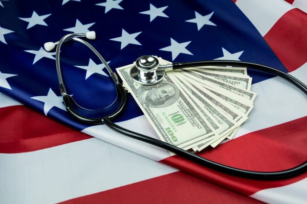American flag with a stethoscope and money