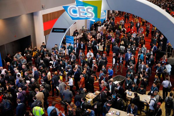FILE - Crowds enter the convention center on the first day of the CES tech show, on,Jan. 7, 2020, in Las Vegas. The annual CE