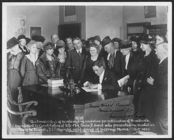 Gov. Emmett D. Boyle of Nevada signing resolution for ratification of Nineteenth Amendment to Constitution of U.S. - Mrs. Sad